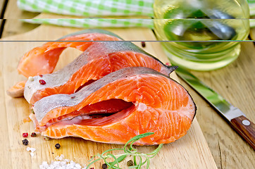 Image showing Trout with oil and salt on board