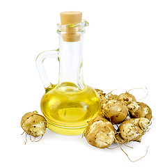 Image showing Jerusalem artichokes with a carafe of oil