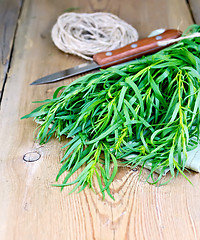 Image showing Tarragon with knife and napkin on board