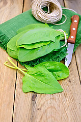 Image showing Spinach on board with knife and napkin