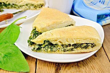 Image showing Pie spinach and cheese on board with knife