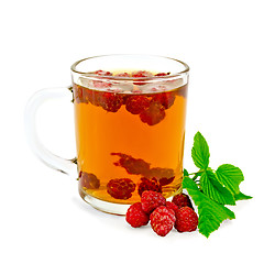 Image showing Tea with raspberry and leaf in glass mug