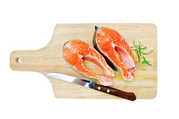 Image showing Trout on the board with a knife and rosemary