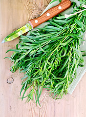 Image showing Tarragon with a knife on board