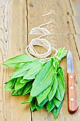 Image showing Sorrel with knife and twine on the board