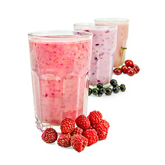 Image showing Milkshakes with berries in glass a row