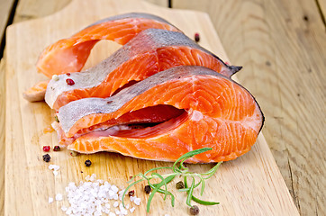 Image showing Trout with salt and rosemary on board