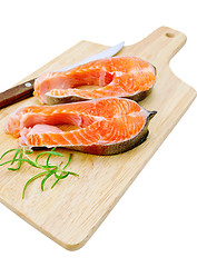 Image showing Trout with a knife and rosemary