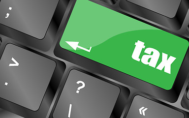 Image showing tax green word on keyboard keys