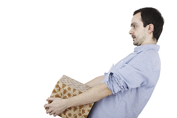 Image showing Young man holding a present