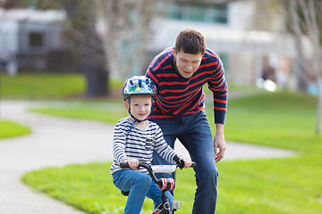 Image showing family biking