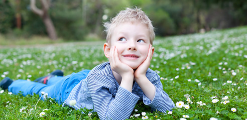 Image showing child lying at grass