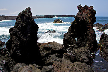 Image showing rock spain   beach water  in lanzarote  isle foam  landscape  st