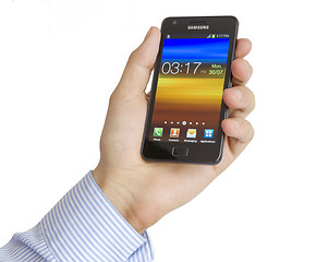 Image showing Hand holding the Samsung Galaxy S2