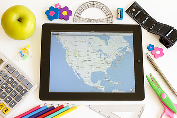 Image showing Ipad 3 with maps and school accesories