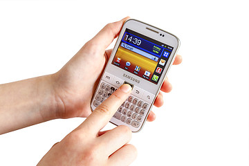 Image showing Hand holding Samsung Galaxy Y Pro B5510