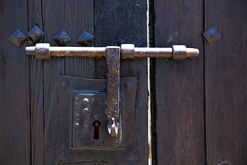 Image showing knocker spain castle lock  door wood in the red brown 