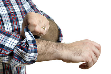 Image showing Man rolls up sleeves