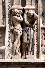 Image showing italy two statue of a men in the front of the duomo  