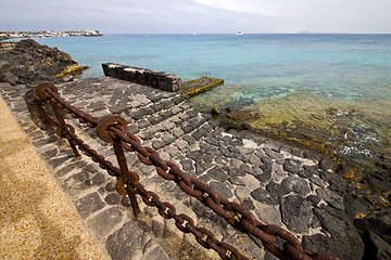 Image showing pier rusty chain  water  boat yacht coastline and summer  lanzar