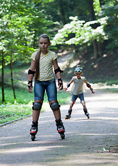 Image showing Kids rollerblading