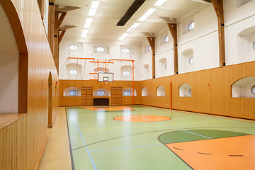 Image showing Empty interior of public gym with basketball court