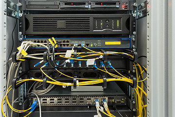 Image showing fiber optic datacenter with media converters and optical cables 