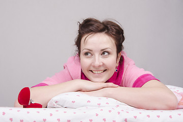 Image showing girl is happy with ring, lying in bed