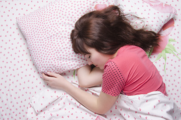 Image showing Young girl sleeping in bed