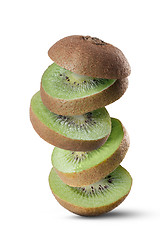 Image showing Falling slices of kiwi fruit isolated on white background