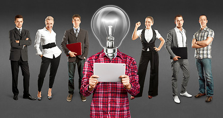 Image showing Business Team With Lamp Head