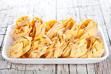 Image showing raw egg pasta in a plate 