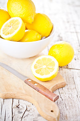 Image showing fresh lemons in a bowl and knife 