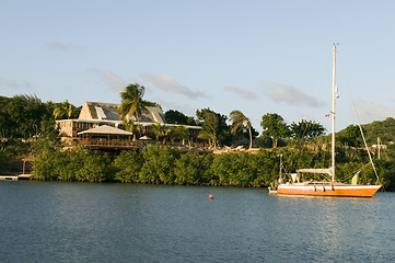 Image showing channel in English Harbor with sailboat and luxury villa Antigua