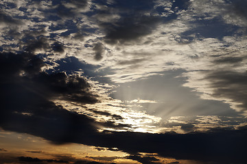 Image showing Dark clouds and sunrise at evening sky