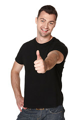 Image showing Happy man giving thumbs up sign