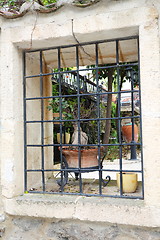 Image showing Wrought iron railing in the window.