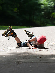 Image showing Little rollerblader takes a tumble