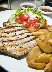 Image showing Polish style grilled pork chops meal as photographed in Krakow P