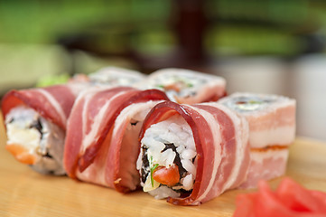 Image showing Sushi roll with bacon