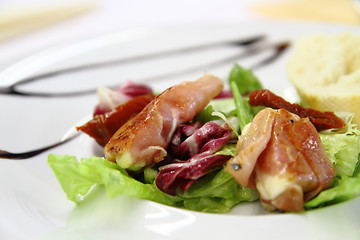 Image showing mozzarella grilled in the pig ham 