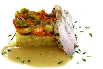 Image showing traditional vegetable ratatouille and pig meat 