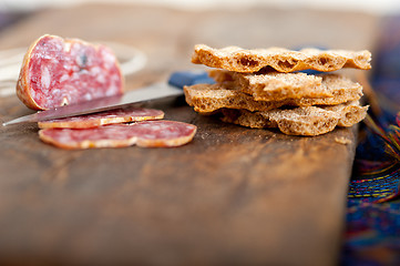 Image showing italian salame pressato pressed slicing