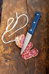 Image showing italian salame pressato pressed slicing