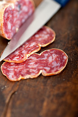 Image showing italian salame pressato pressed slicing