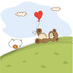 Image showing teddy bear with heart on meadow