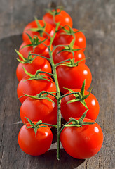 Image showing cherry tomatoes on vintage wooden table
