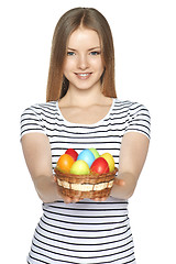 Image showing Female holding basket with Easter eggs