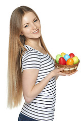 Image showing Female holding basket with Easter eggs