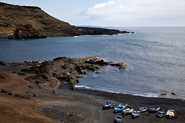 Image showing boat stone  atlantic ocean sky  water lanzarote in el golfo  